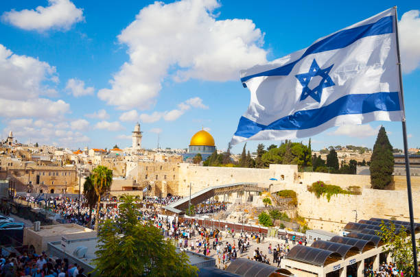 Israel flag with a view of old city Jerusalem and the KOTEL- Western wall | ThisNigeria